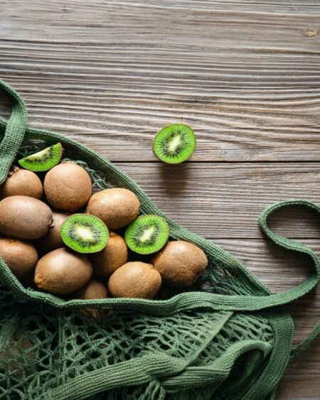 Homemade kiwi jam in a glass jar, made from fresh Himalayan kiwis, with a rustic label and wooden spoon beside it – a natural and fruity delicacy from Himachal Pradesh 5- Himachalbox.com